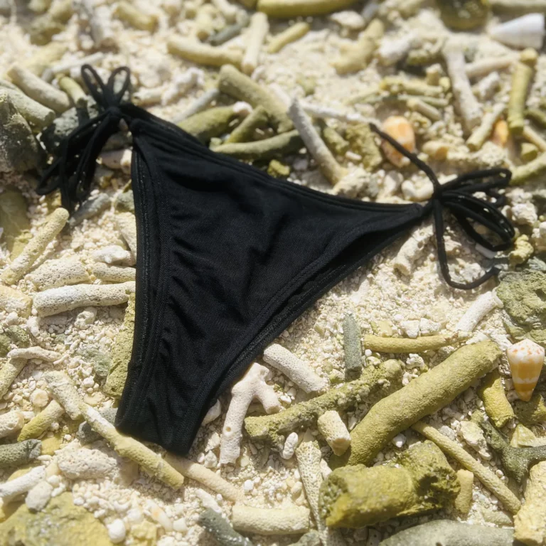 Black mid-rise Chloe Bottom bikini with adjustable tie sides for a perfect fit.