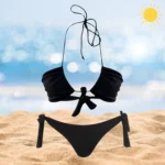 Chic Layla & Ava black beachwear set with adjustable ties and tan-through fabric.