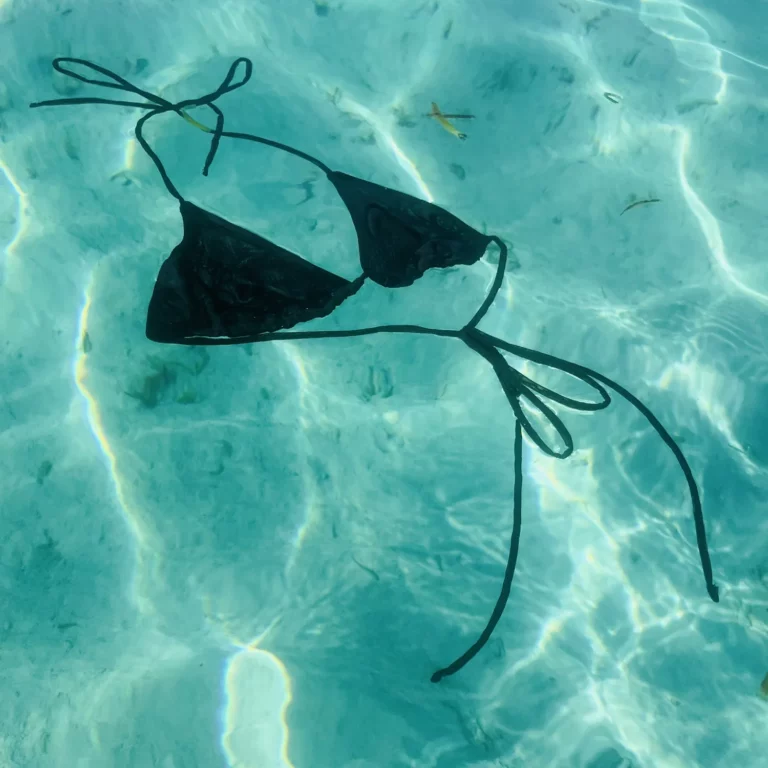 Black Kira Top triangle bikini with adjustable ties and unlined fabric.