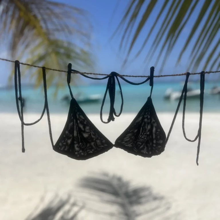 Black Kira Triangle Bikini Top with Adjustable Ties for a Perfect Fit and Flawless Tan.