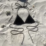 Black Kira Top bikini with adjustable ties and natural feel for flawless tanning.