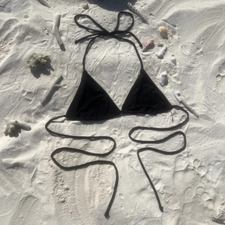 Black Kira Top bikini with adjustable ties and natural feel for flawless tanning.