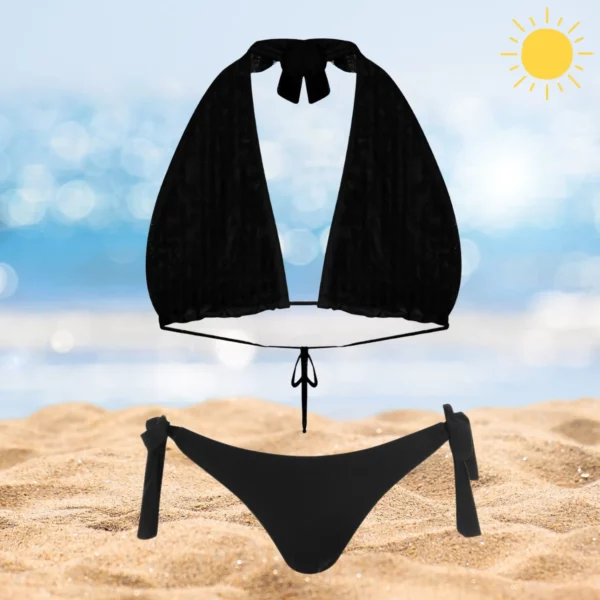 Chic Layla & Ava black beachwear set with adjustable ties and tan-through fabric.
