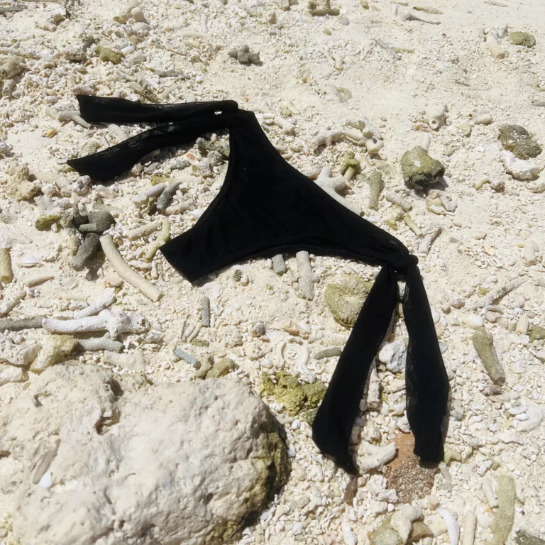 Black Ava Bottom bikini with adjustable ribbon ties for chic beach style.