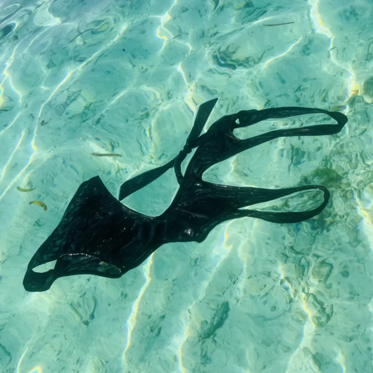Modern Sienna One Piece black swimsuit with high-waisted bottom and adjustable ties.