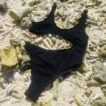Sienna One Piece, black tan-through swimsuit with high-waisted bottom and adjustable ties.