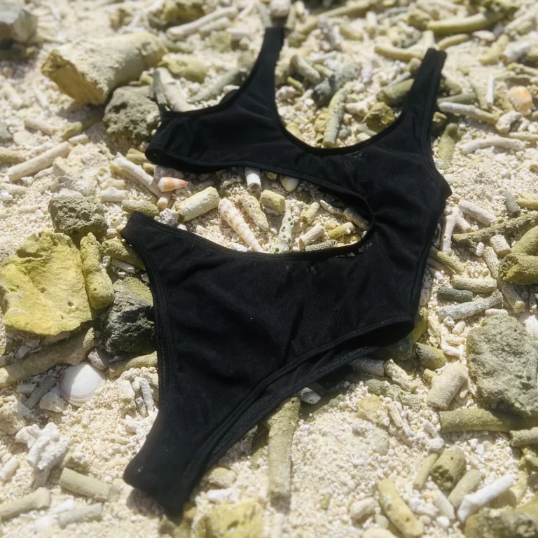 Sienna One Piece, black tan-through swimsuit with high-waisted bottom and adjustable ties.
