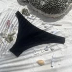 Black Zara bikini bottom for a flattering, tan-through beach look.