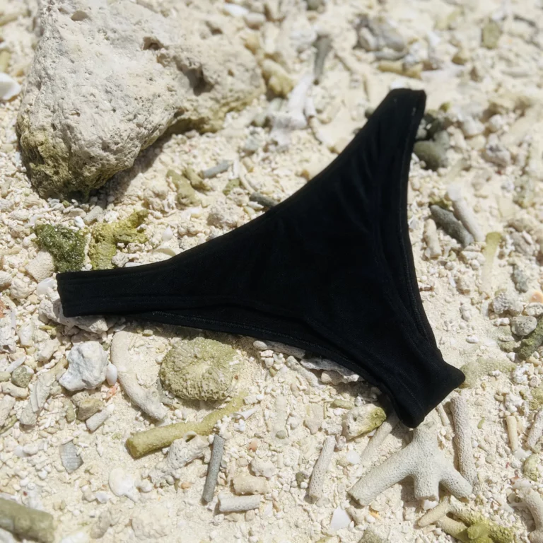 Zara Bottom bikini in black tan-through fabric, perfect for a comfortable and sleek beach day.