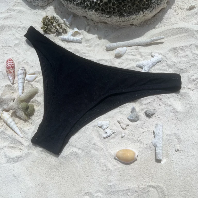 Zara Bottom bikini in black tan-through fabric for a flattering beach look.